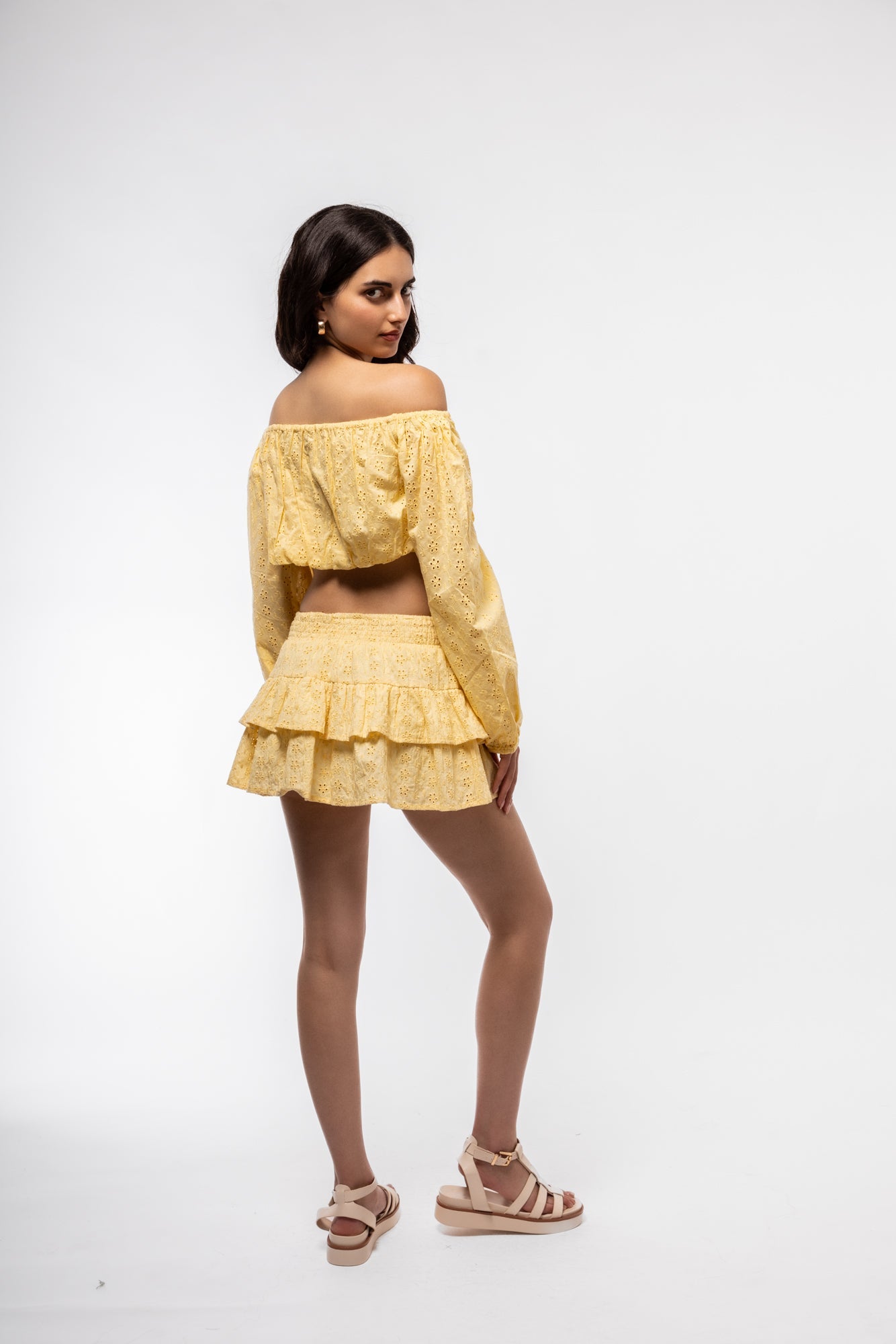 Back angle of frilled broderie skirt – romantic and flirty style