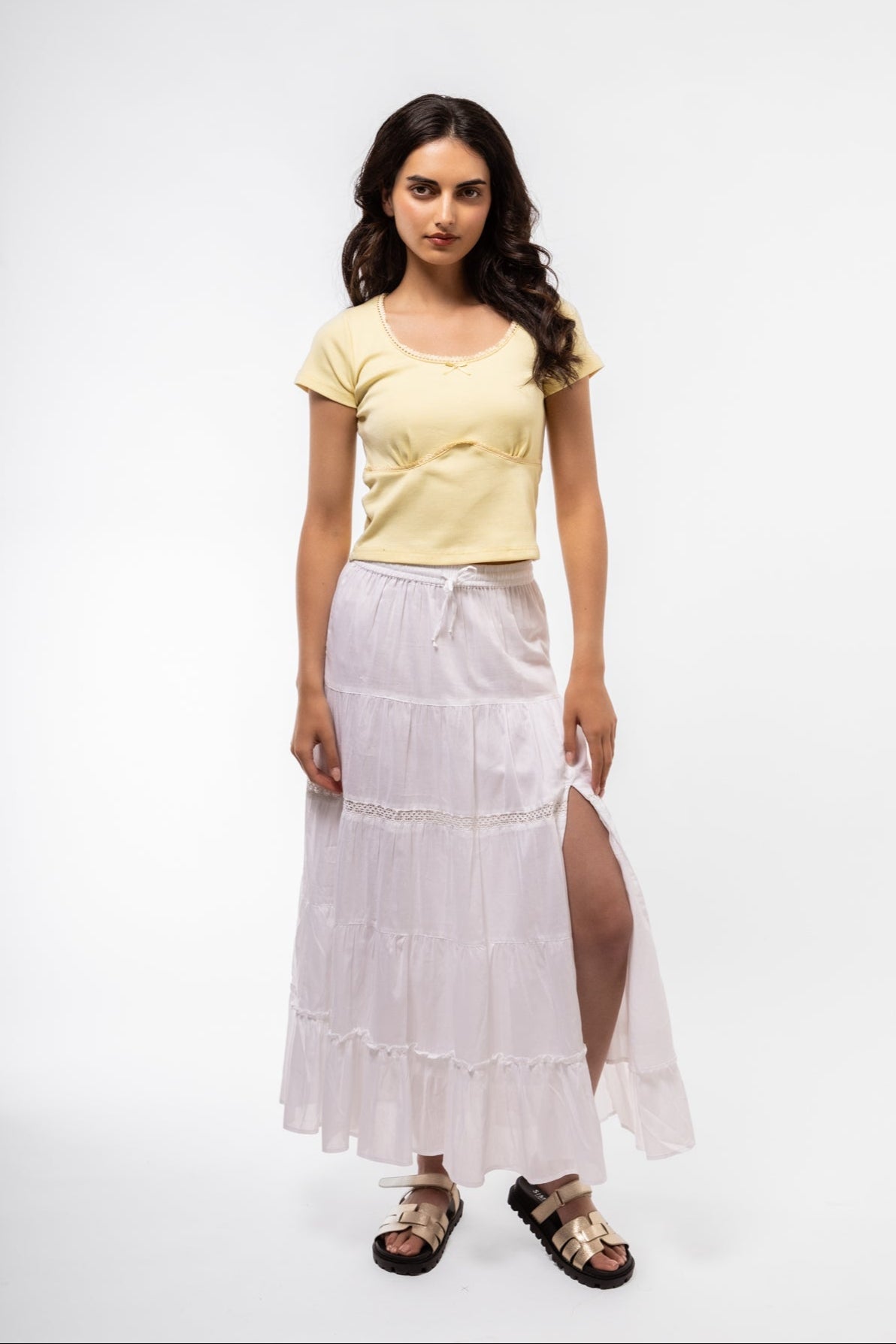 Bright lemon lace-trimmed top featuring soft stretch fabric and scoop neckline
