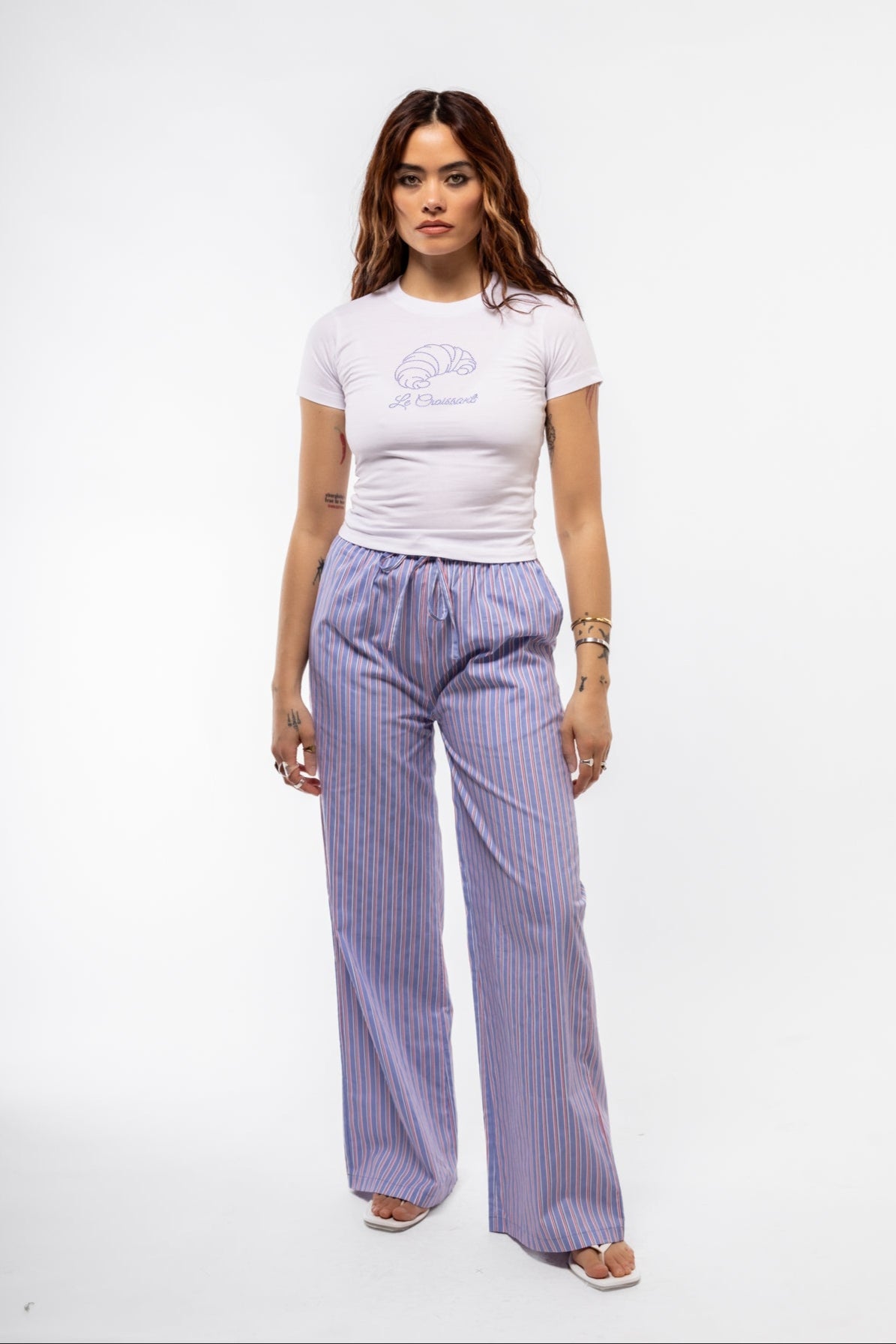 Casual front view of light blue striped lounge trousers with soft drape and high waist.