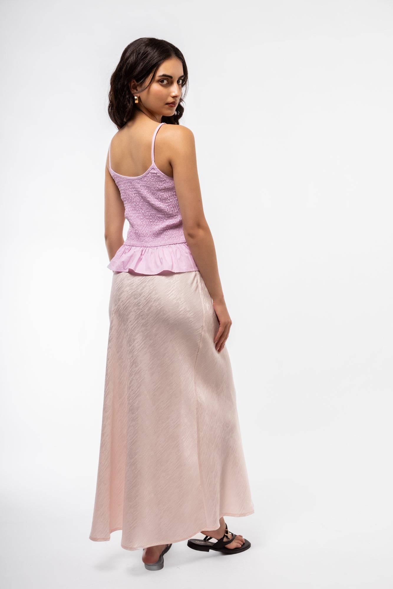 Casual side angle of jacquard midi skirt displaying woven jacquard pattern and refined finish
