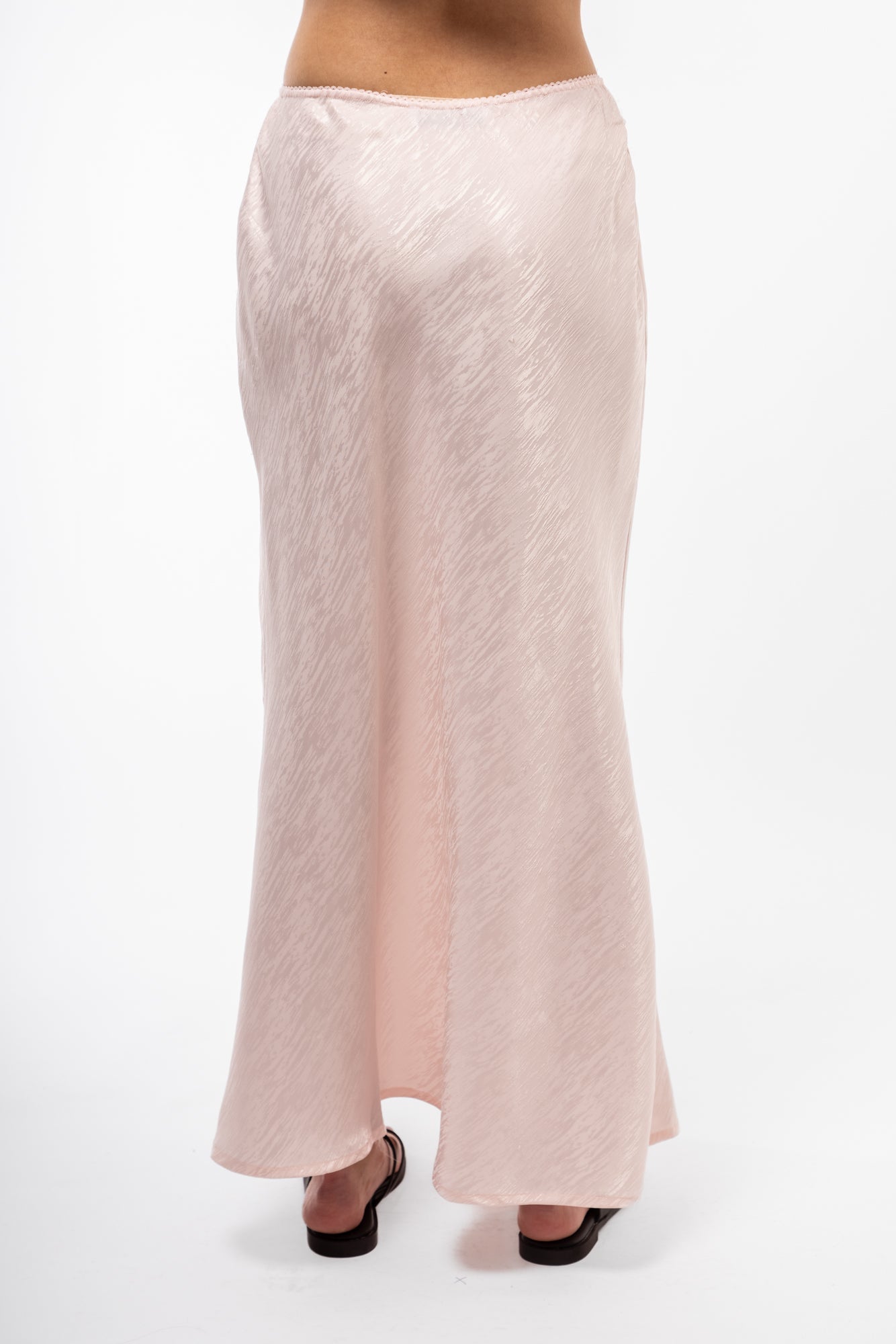 Close-up back image of jacquard midi skirt highlighting detailed jacquard design and midi length