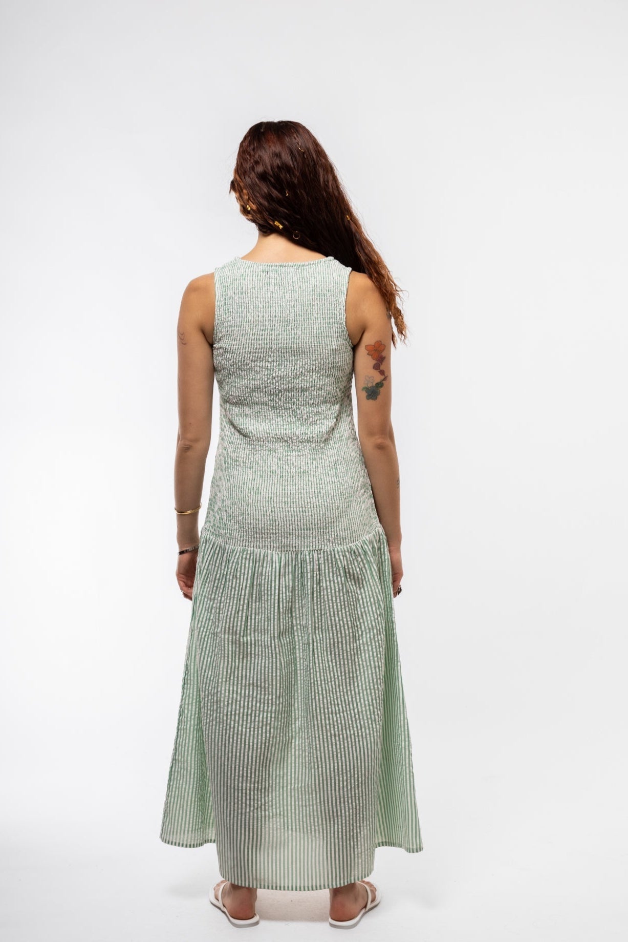 Feminine mint green midi dress with gathered back and drop waist