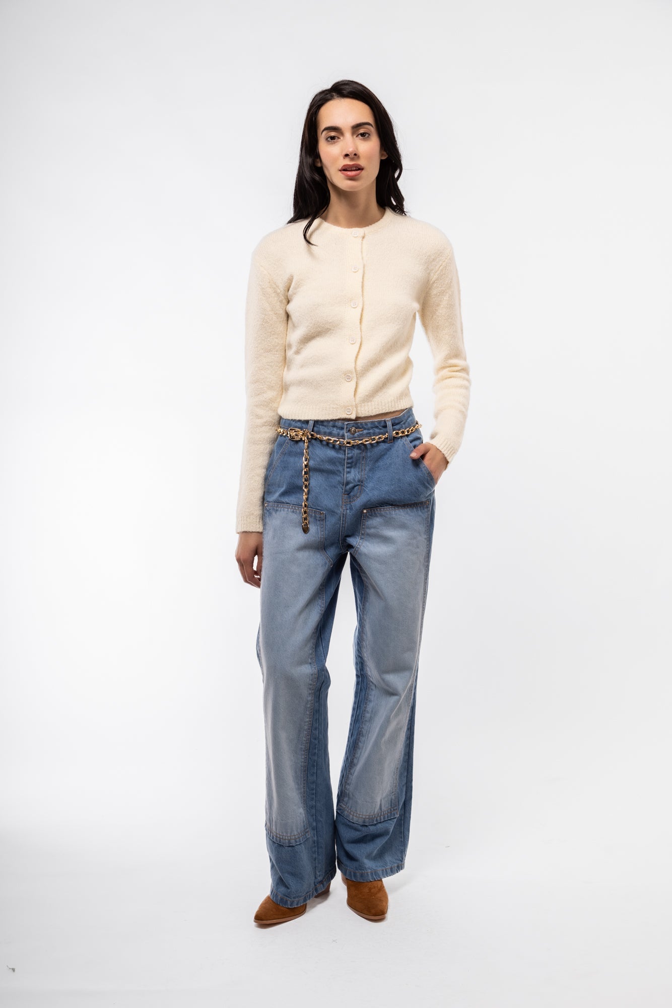 Front image of wide leg jeans with chap-style cutouts and medium wash finish.