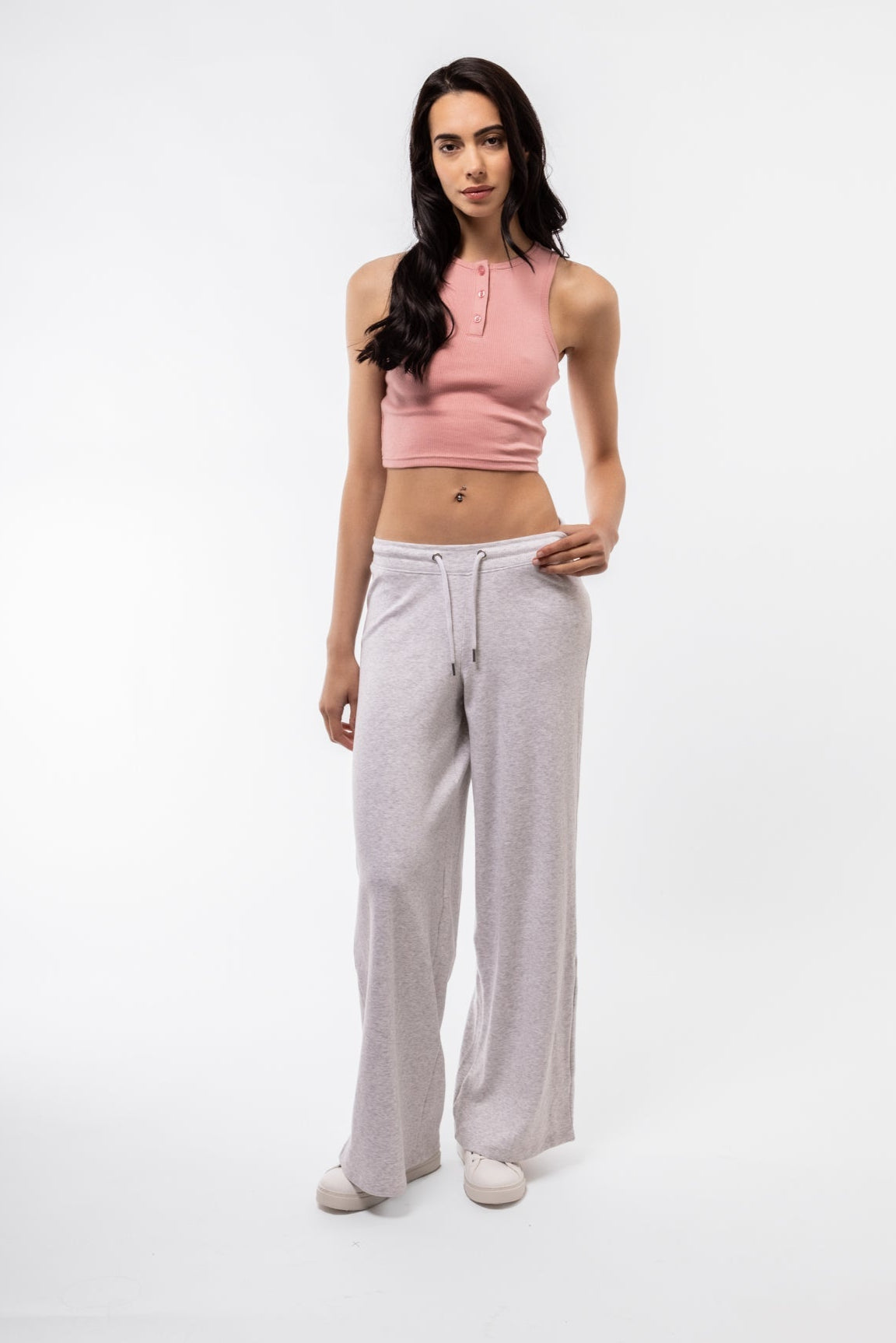 Front view of pink button placket racer top in soft pastel tone and fitted cut.