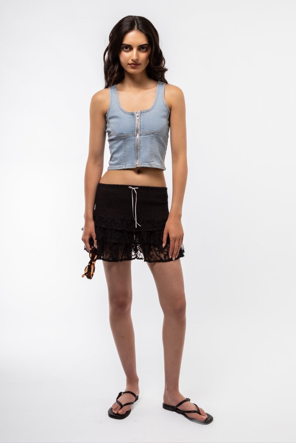 Front view of square neck denim zip top with silver zipper and fitted silhouette.