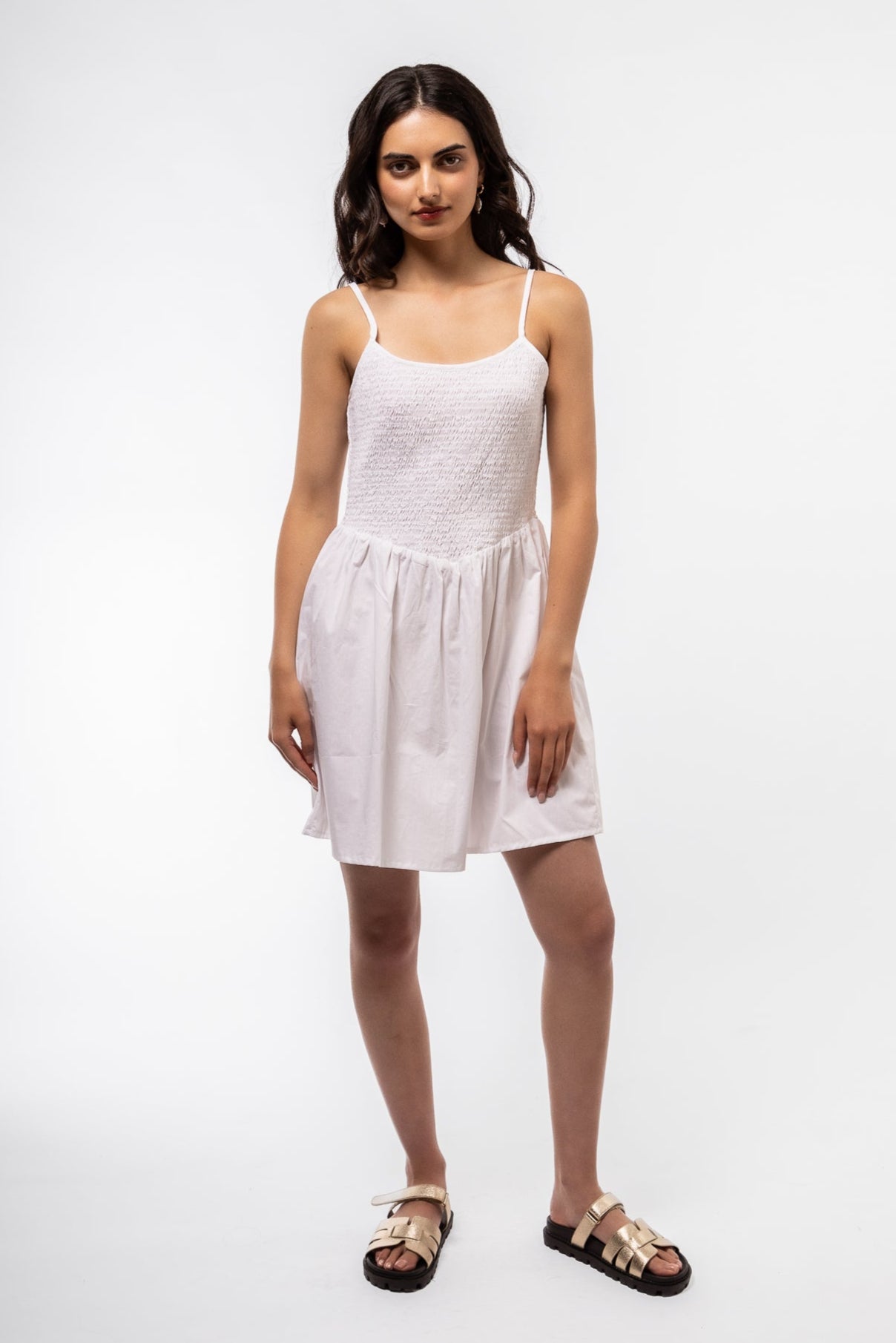 Front view of the white shirring cami v mini dress