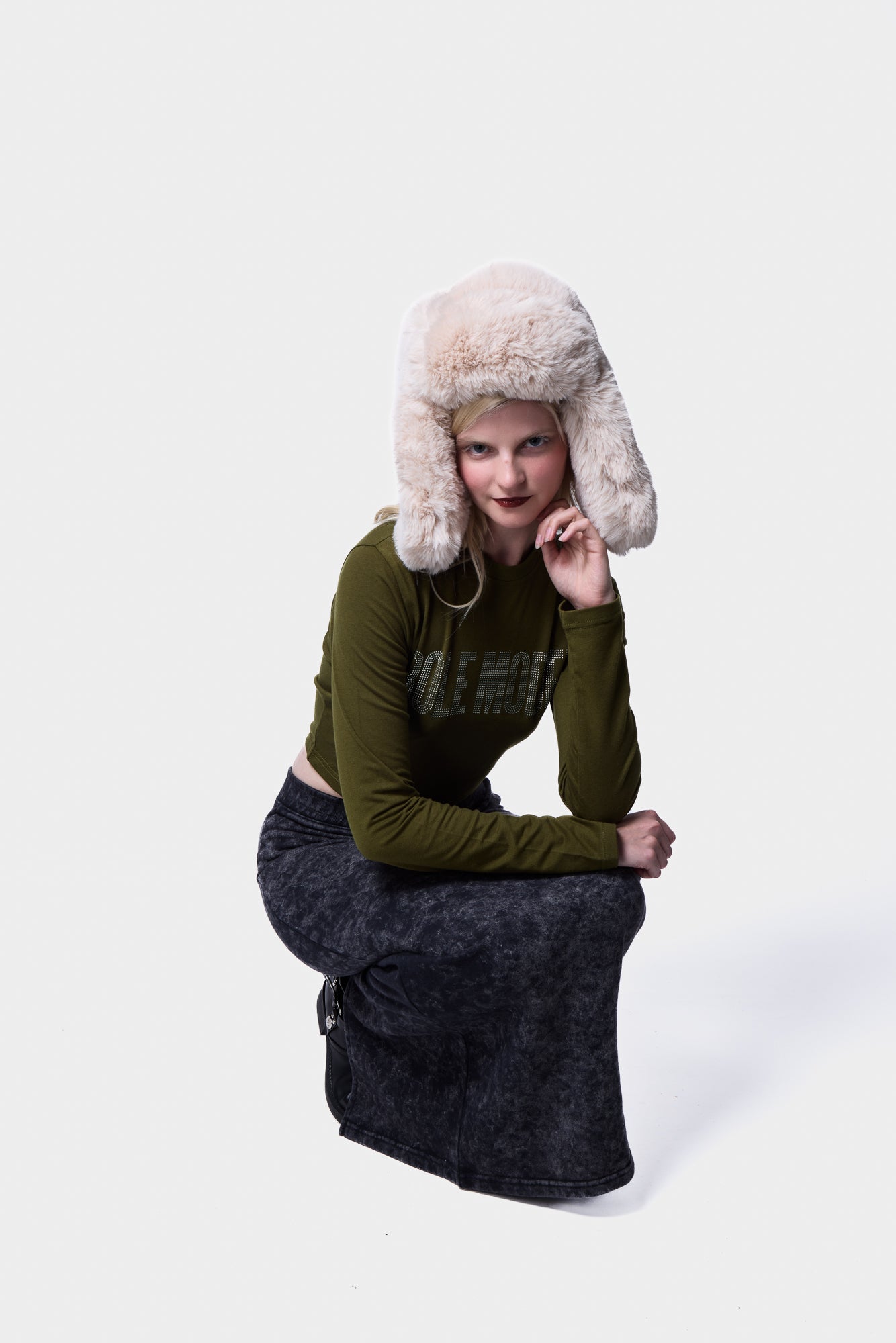 Full-length view of the acid wash tube skirt sweatshirt styled in a studio environment