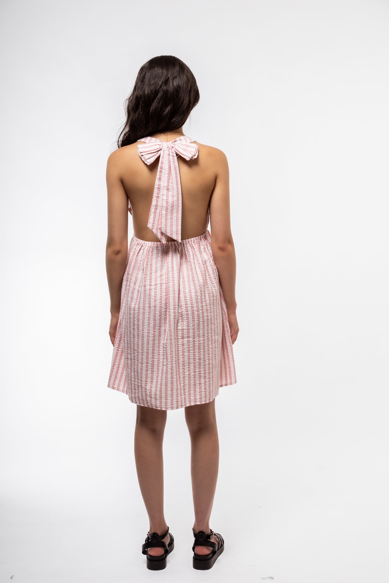 Halterneck dress rear image showing keyhole back detail and sleek silhouette