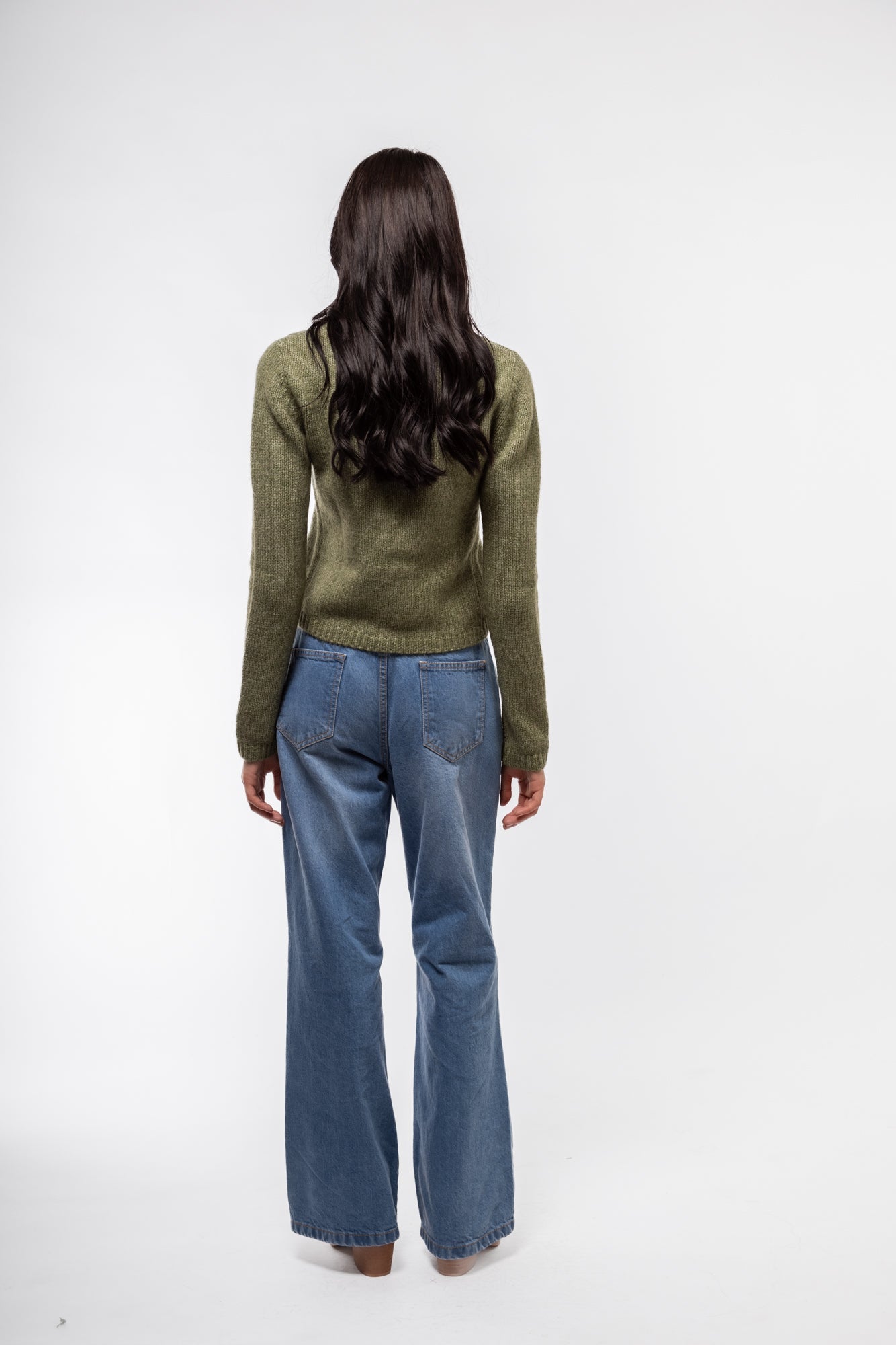 Back silhouette of lightweight olive knitwear