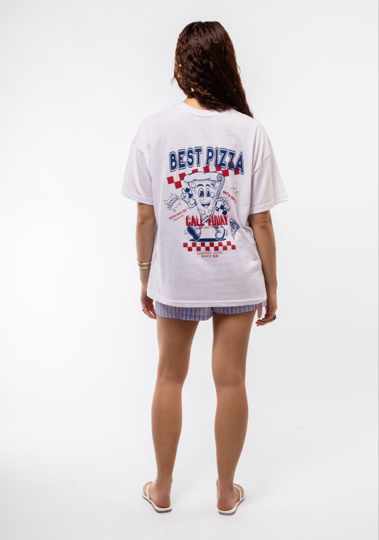 Back view of Best Pizza oversized tee featuring large pizza-themed graphic and playful design