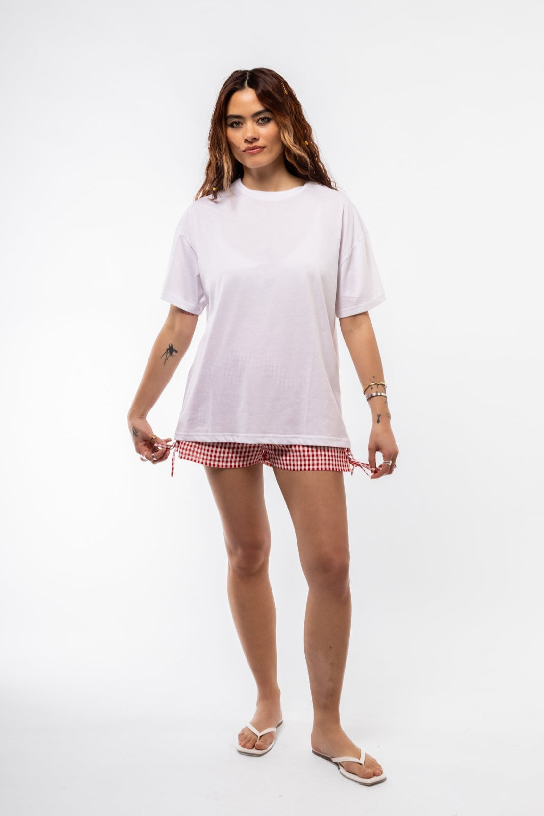 Model wearing Out of Office tee with cowboy cat print and soft drop-shoulder silhouette