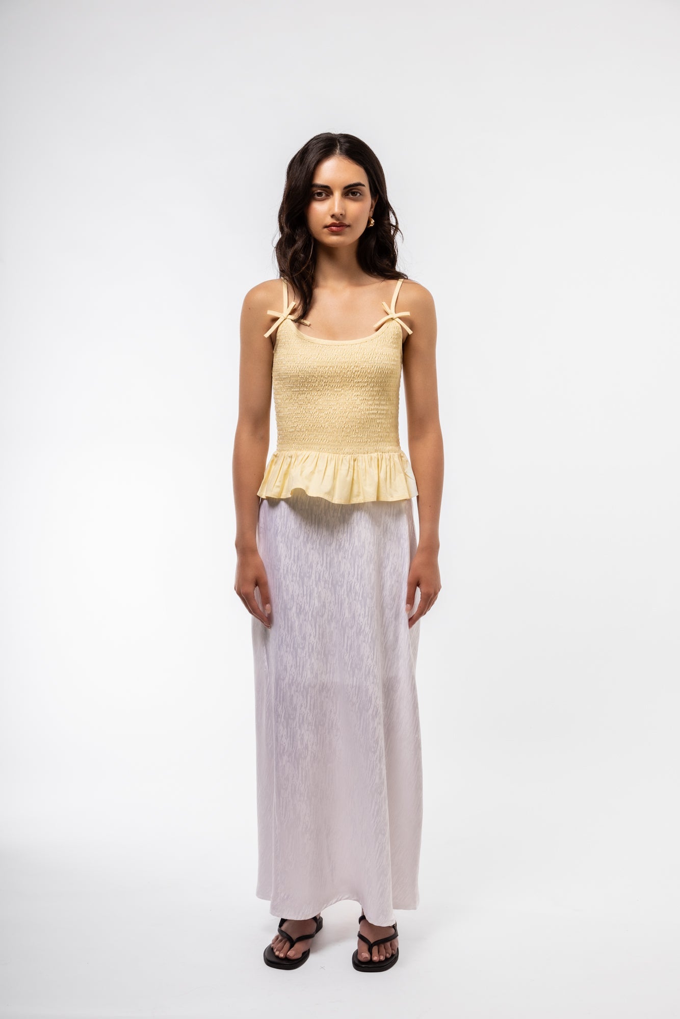 Front view of jacquard midi skirt featuring intricate woven pattern and high-waisted fit