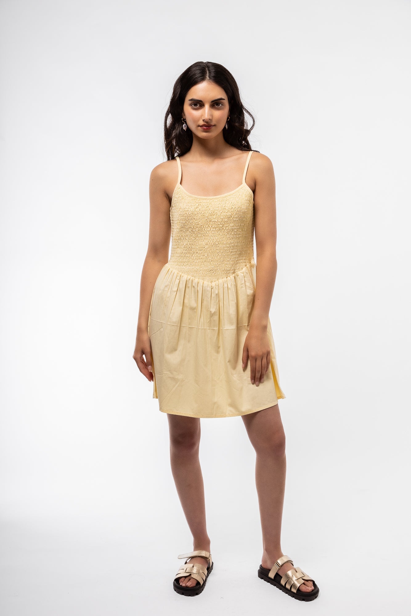 Model wearing the shirring v mini dress in yellow front view