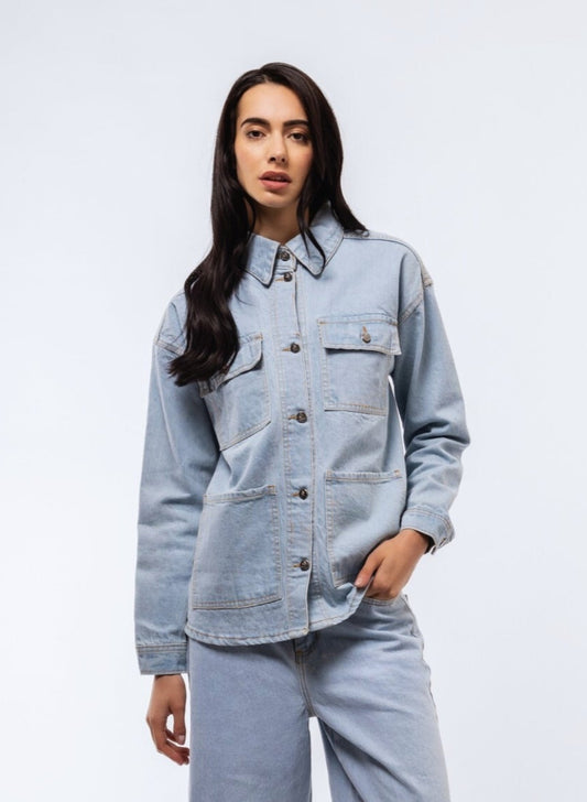 Oversized longline shirt in denim wash front view with clean button details.