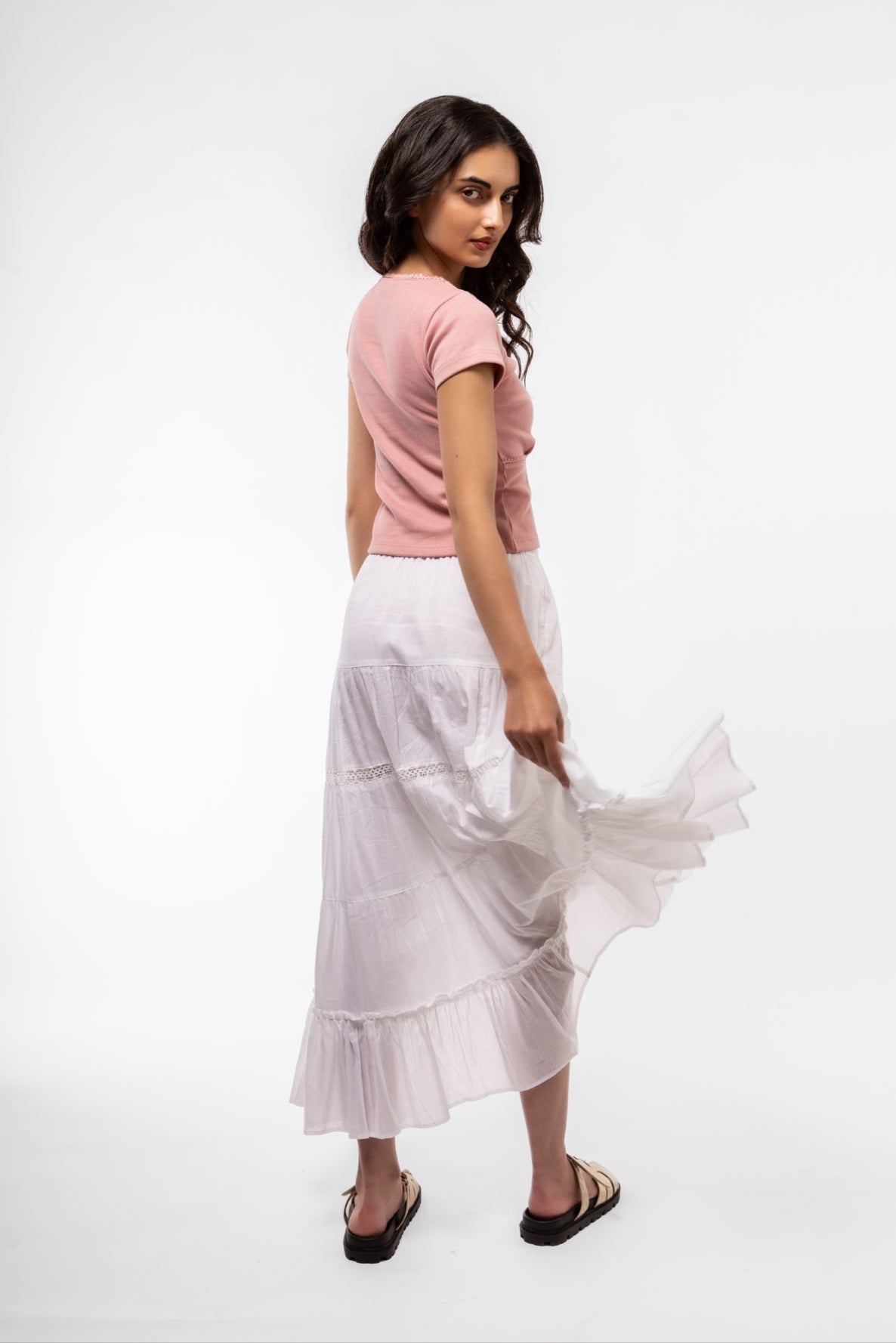 Pink lace-trim top side view showing soft ribbed texture and relaxed curve