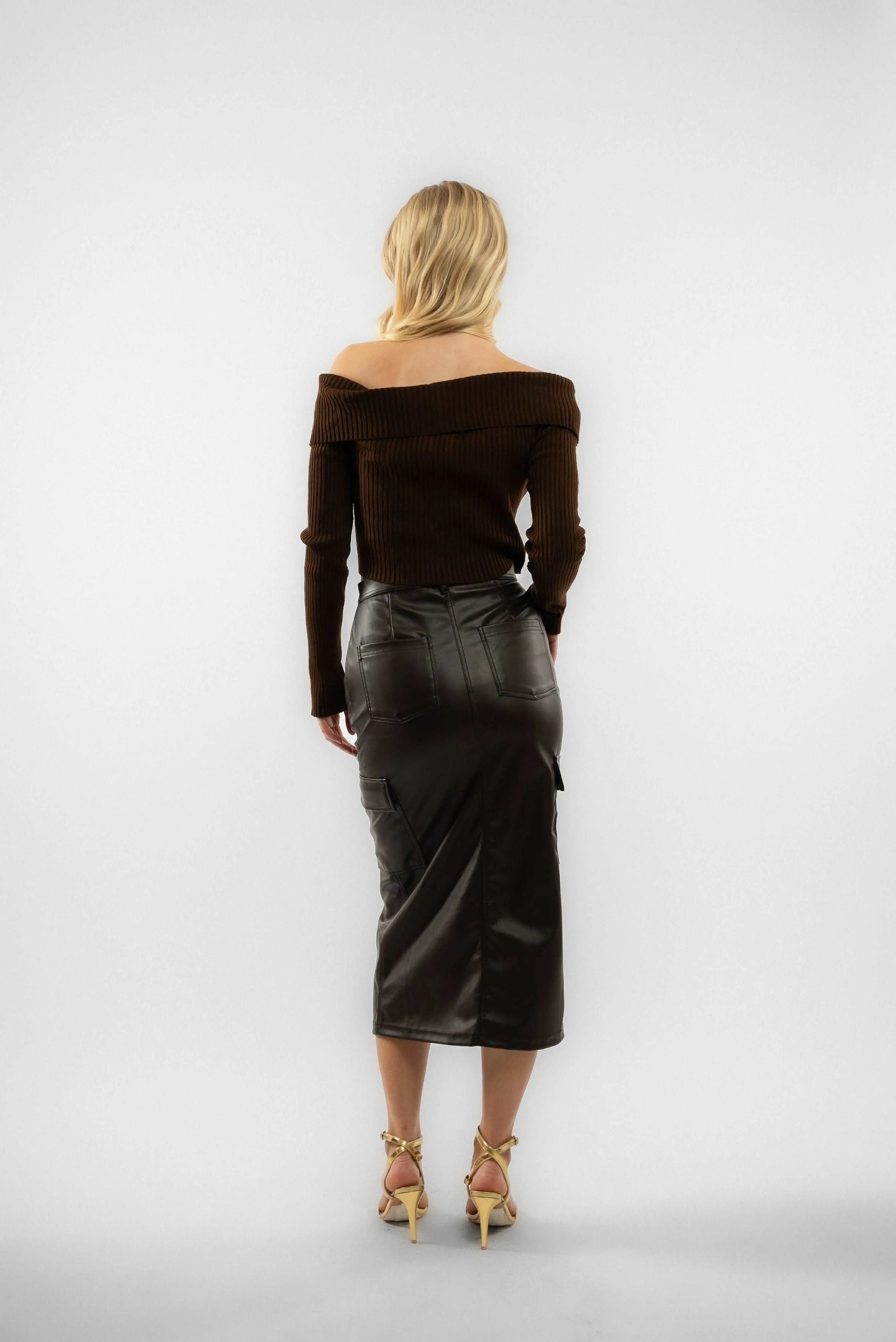 a woman wearing a brown knitted zip through top