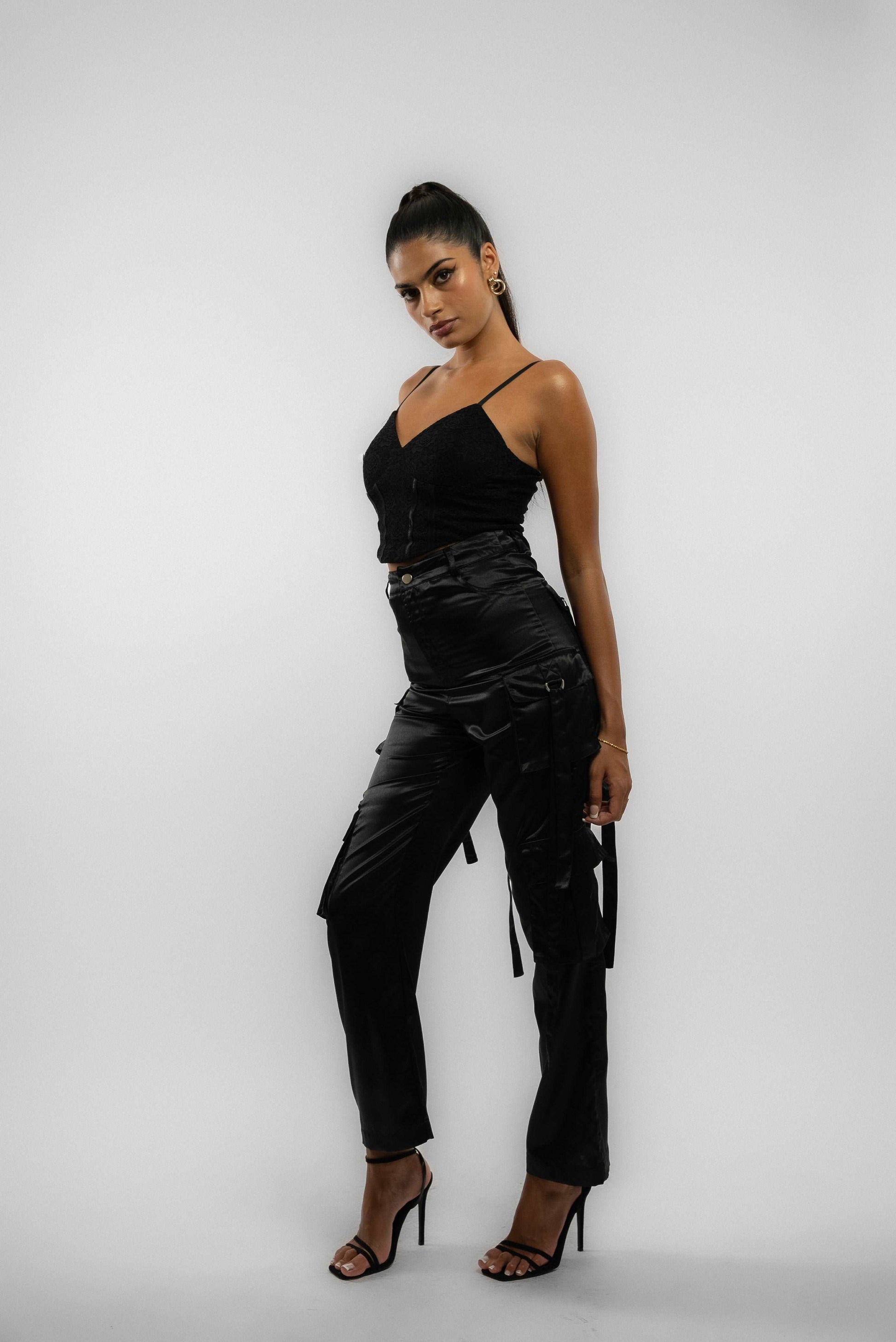 a woman in a wearing a heavy satin trousers