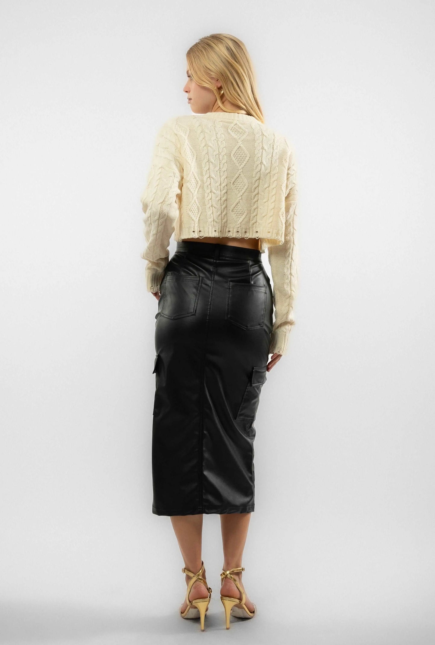 a woman wearing a faux leather skirt from silkroad daughters
