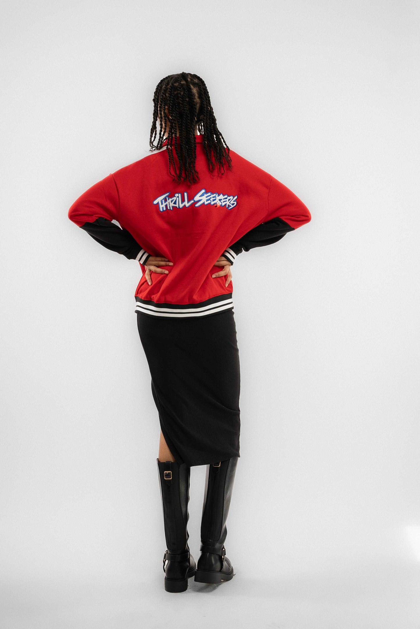 a woman posing wearing a black slit skirt silkroad daughters