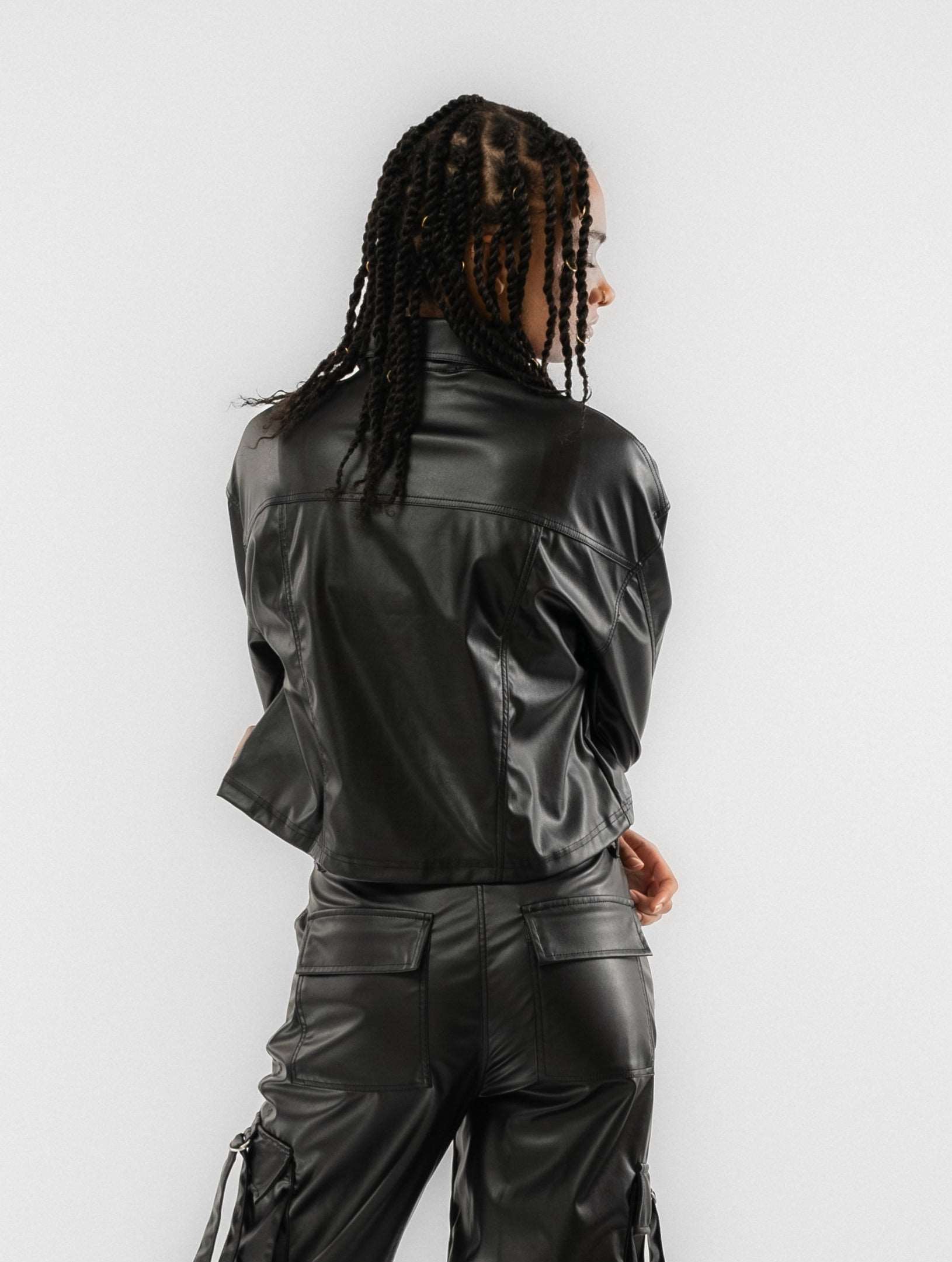 a woman wearing a black leather jacket
