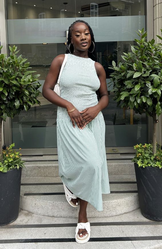 Mint green midi dress with ruched bodice and relaxed silhouette – front angle