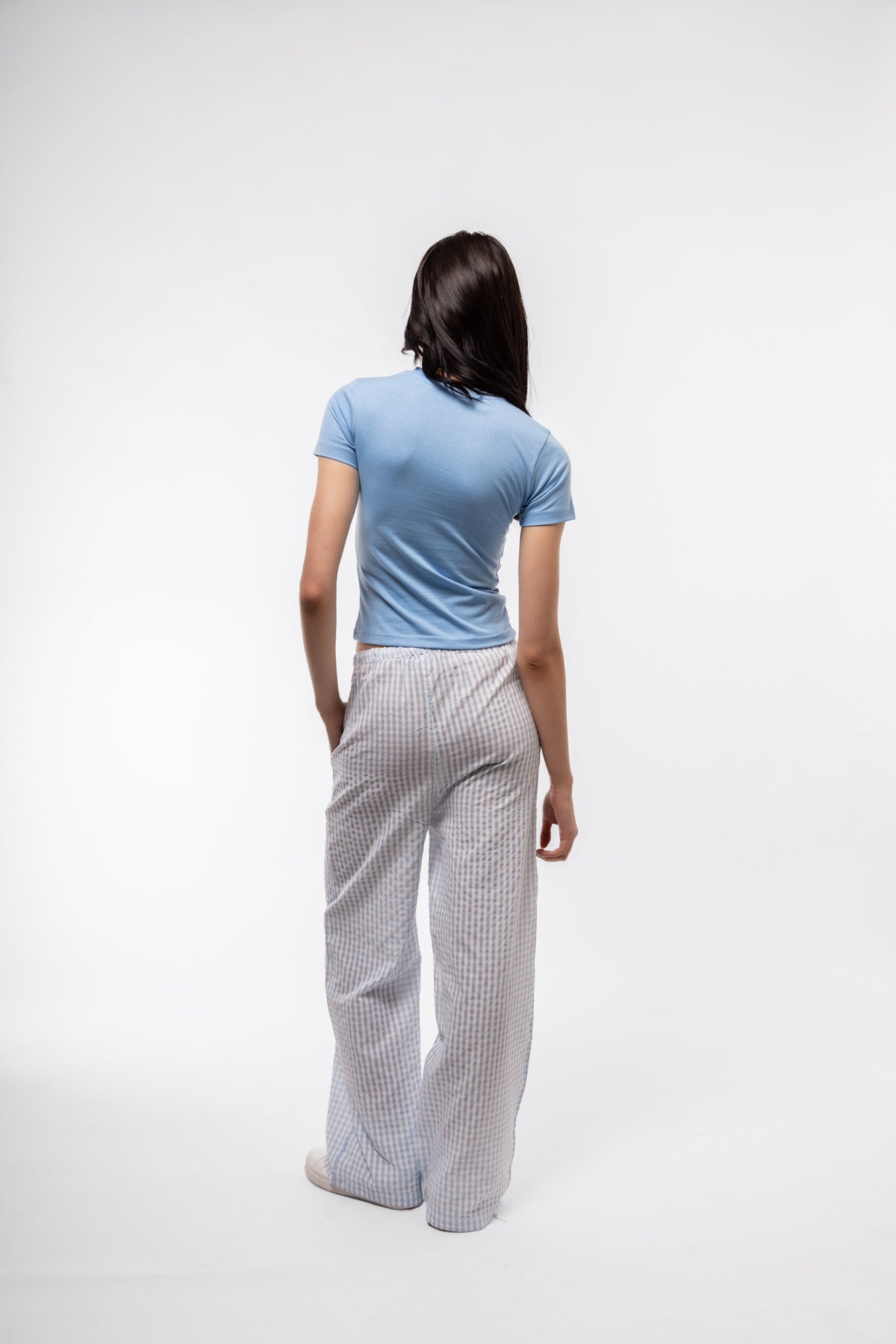 Sky blue gingham pants for women, back view showing clean finish and cropped legs.