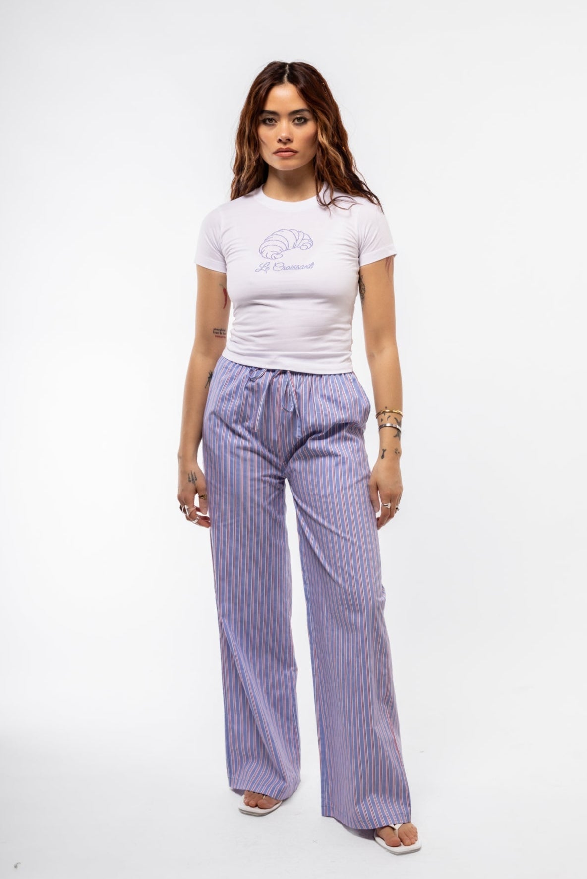 Casual front view of light blue striped lounge trousers with soft drape and high waist.