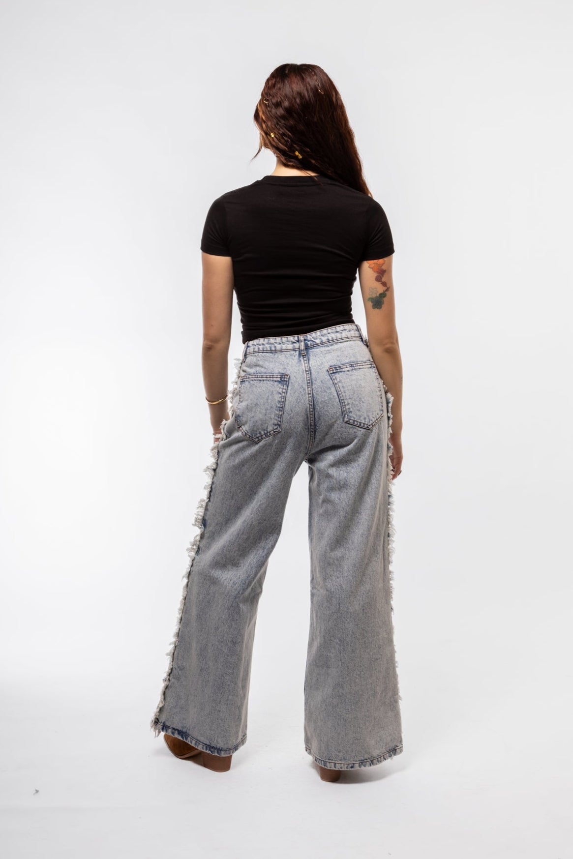 back shoot of the denim fringe jeans