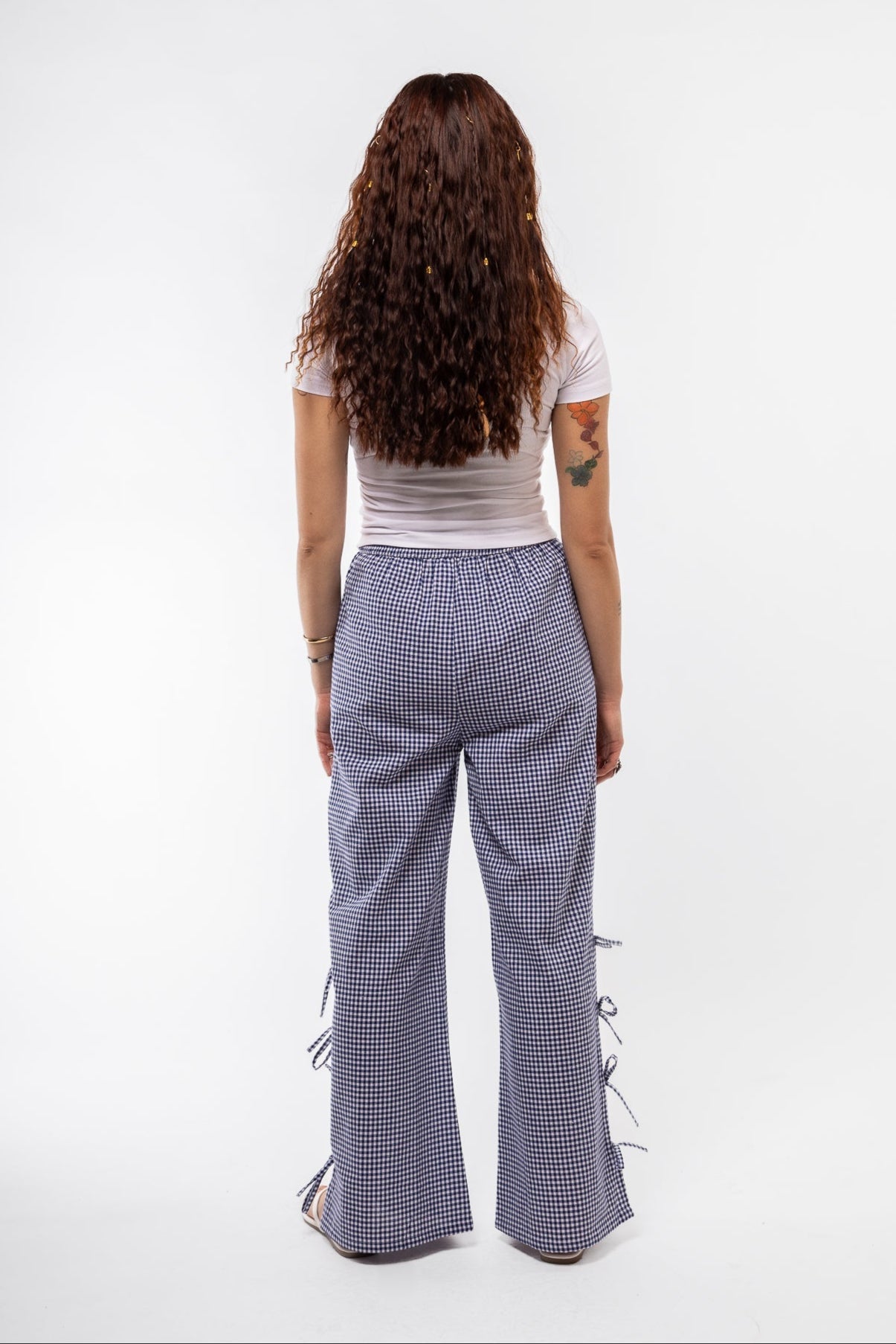 back view of the blue gingham trousers with side bows
