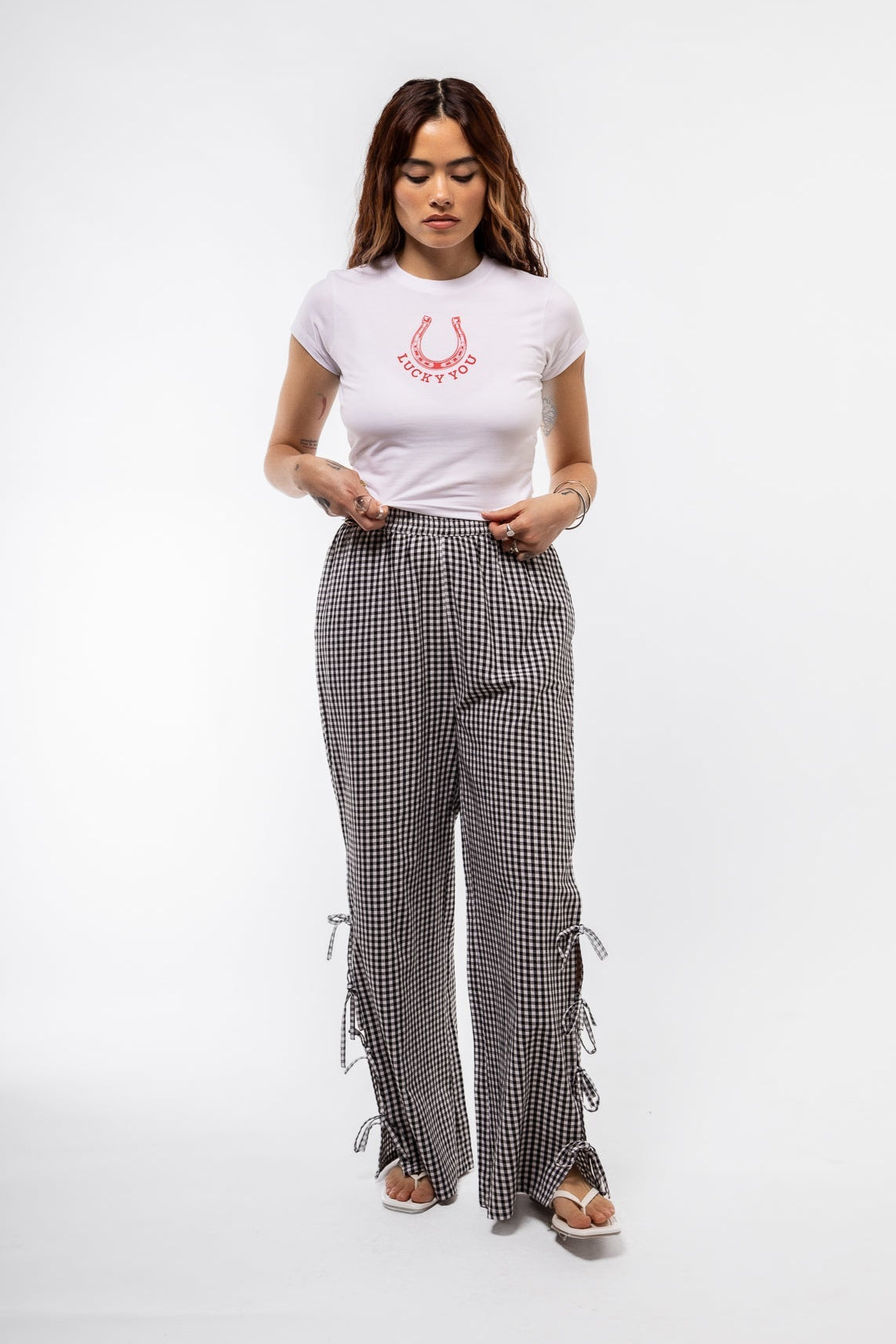 front view of the black gingham side details bows