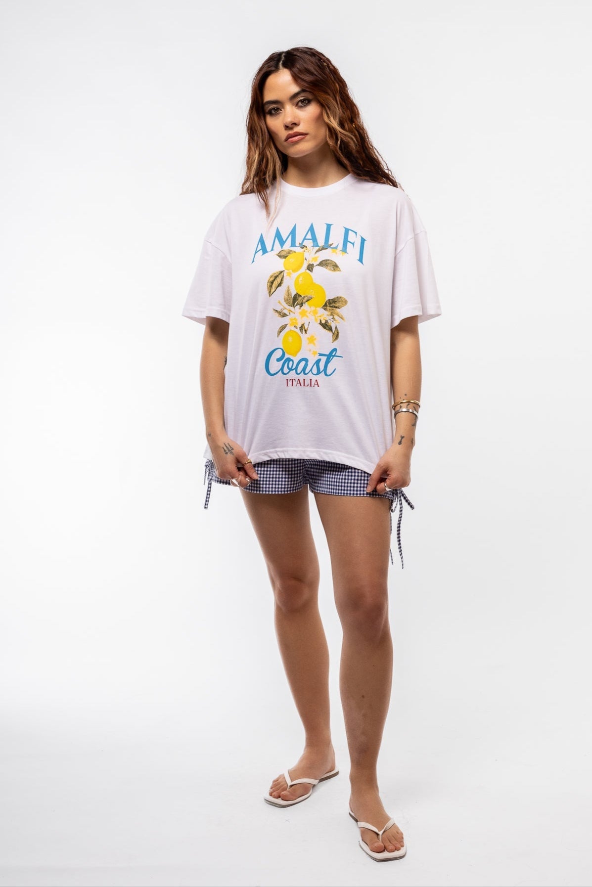 front view of the blue gingham shorts with side detail bows
