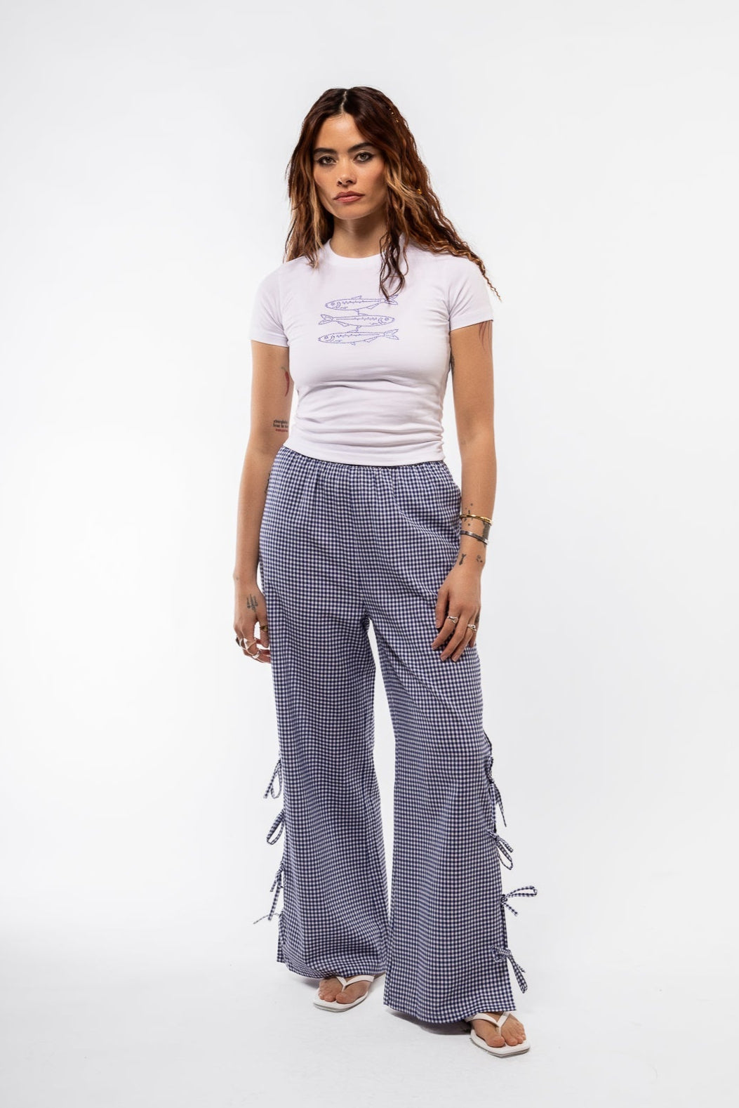front view of the blue gingham trousers with side bows perfect for holidays,picnics and loungewear