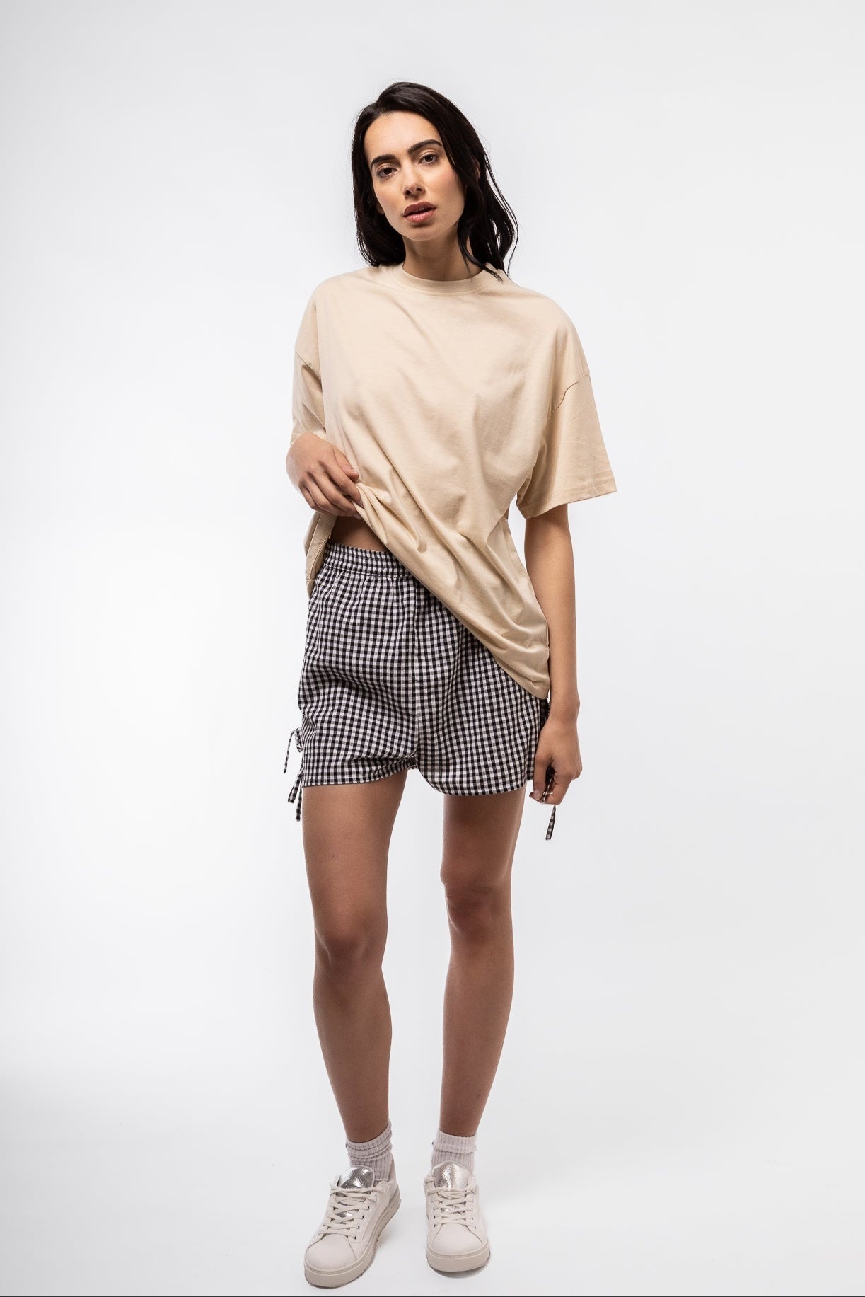 front view of the gingham shorts in black with side bows