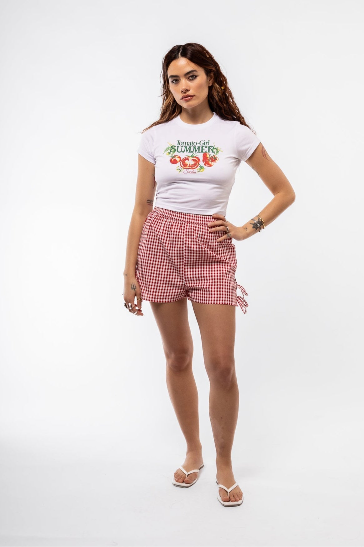 front view of the gingham shorts with side detail bow in red