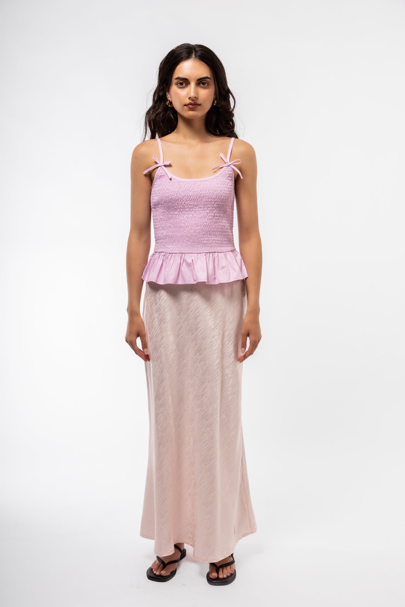 Jacquard midi skirt front shot showcasing elegant textured fabric and structured silhouette