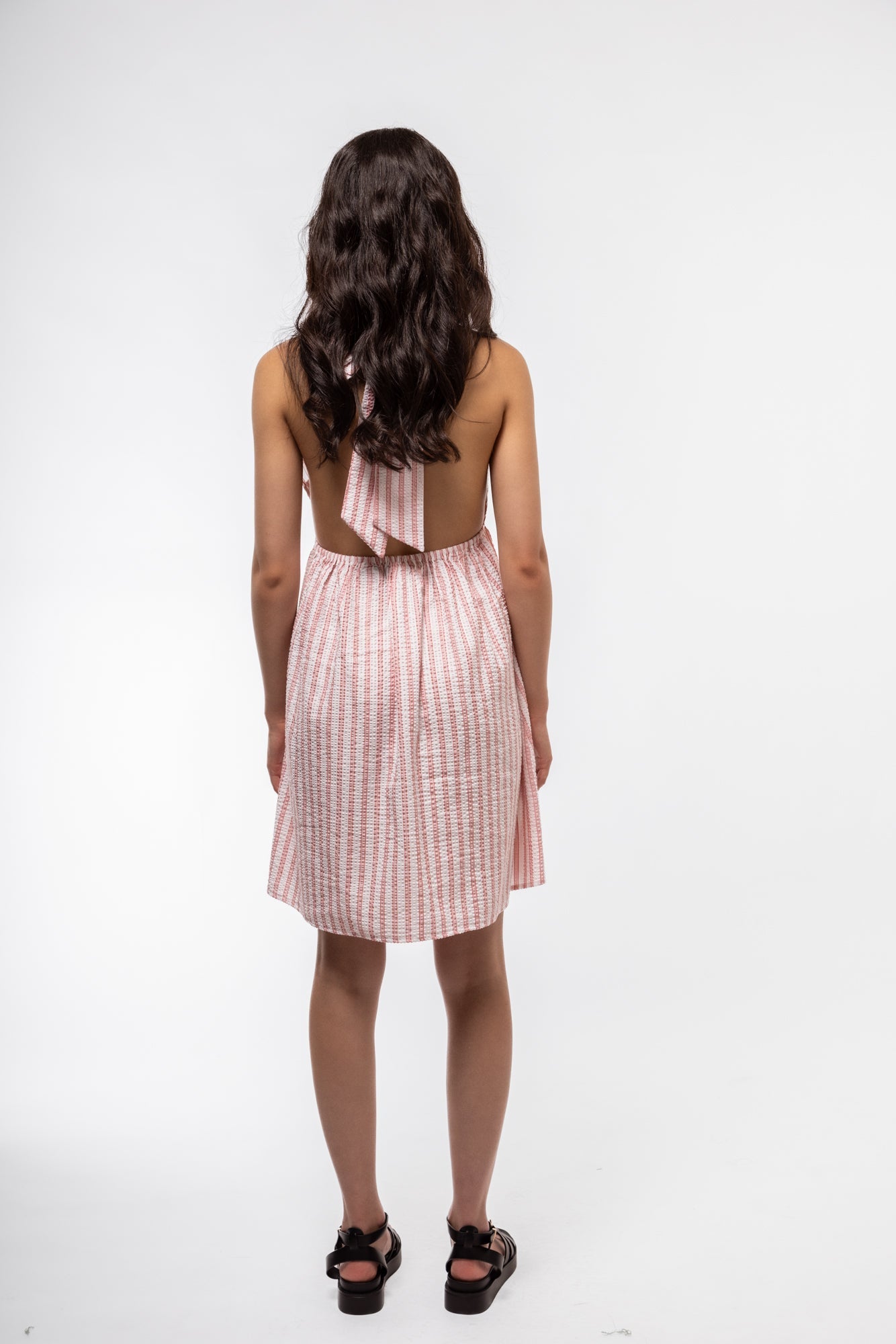 Halterneck dress rear image showing keyhole back detail and sleek silhouette