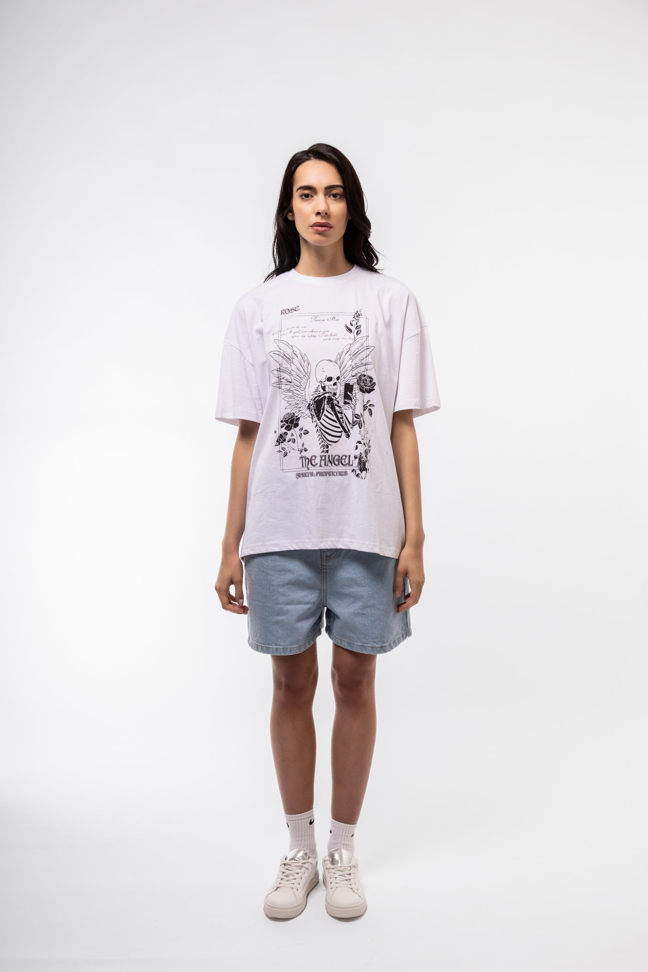 model wearing a  Relaxed Denim Shorts front shot showcasing button closure and five-pocket design
