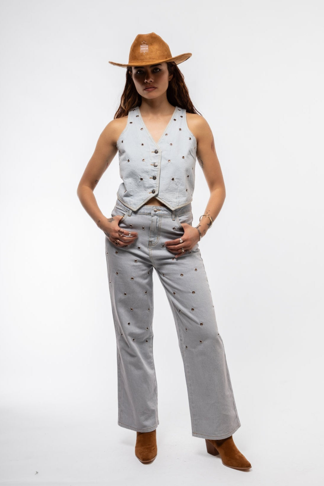 sleeveless denim vest with metallic studs, structured colla