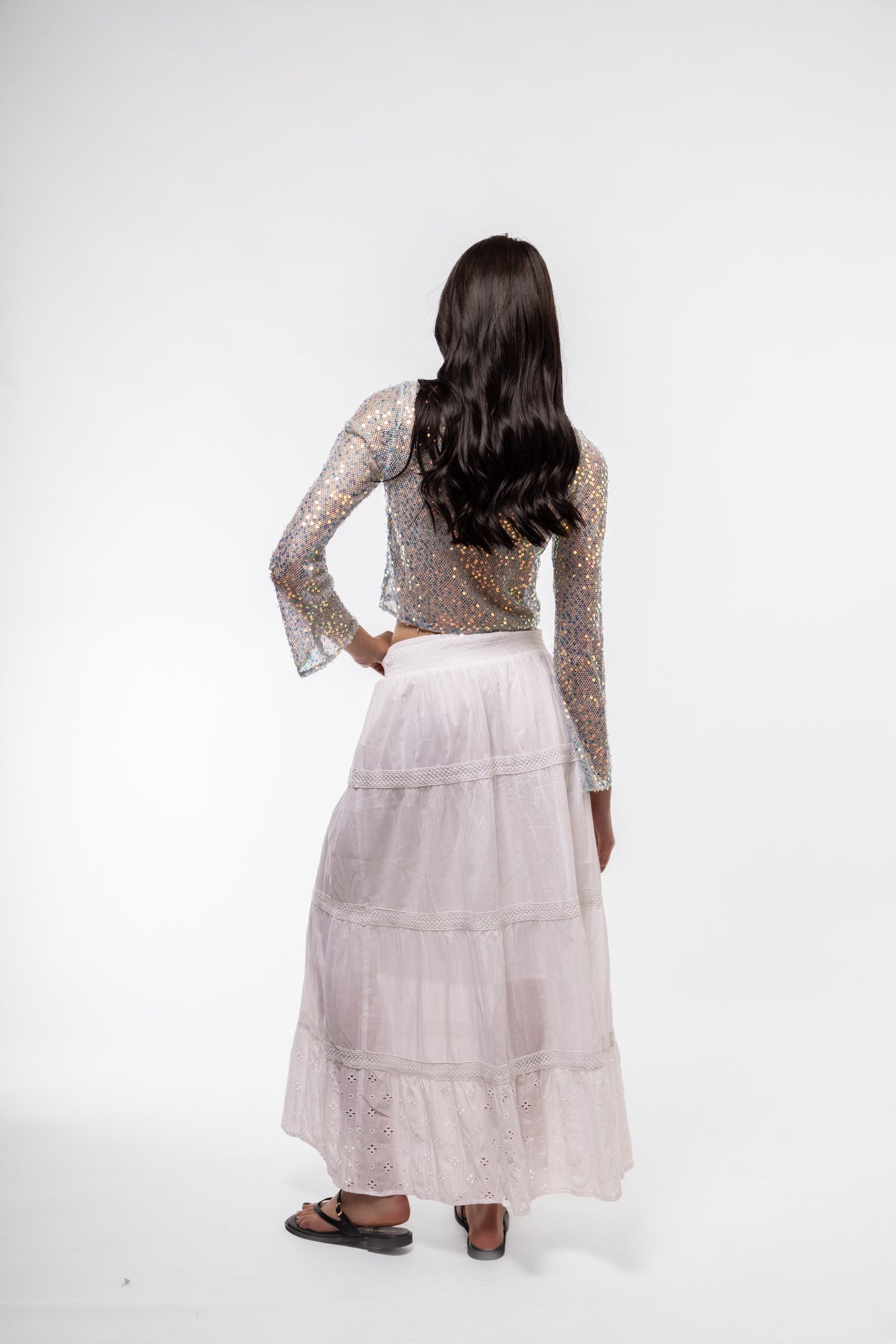 Back view of sequin crochet knit top – shimmering and breathable

