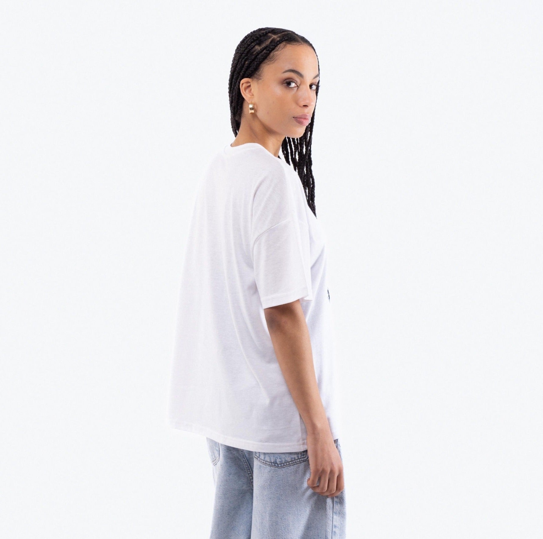 a woman in a oversized Tee outfit posing for a picture