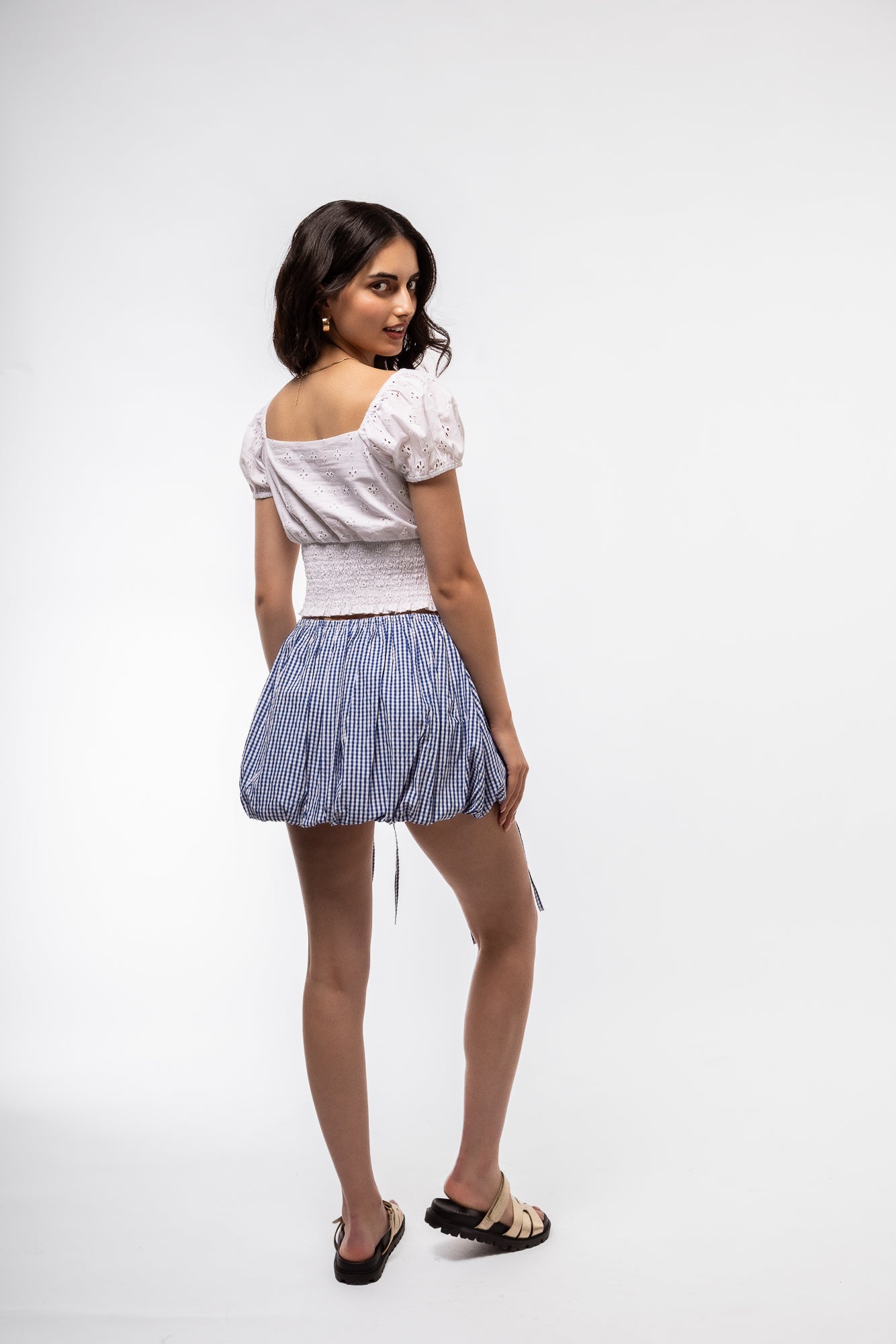 Back Profile view of the blue gingham skirt with tie details 