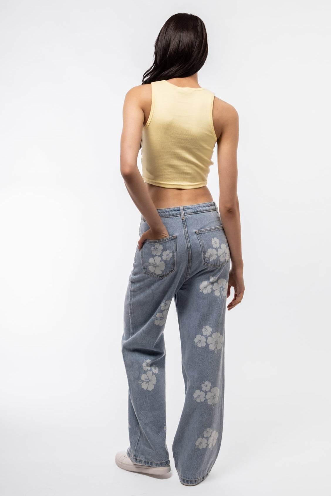 Back image of printed wide leg denim pants with all-over graphic and relaxed back fit.

