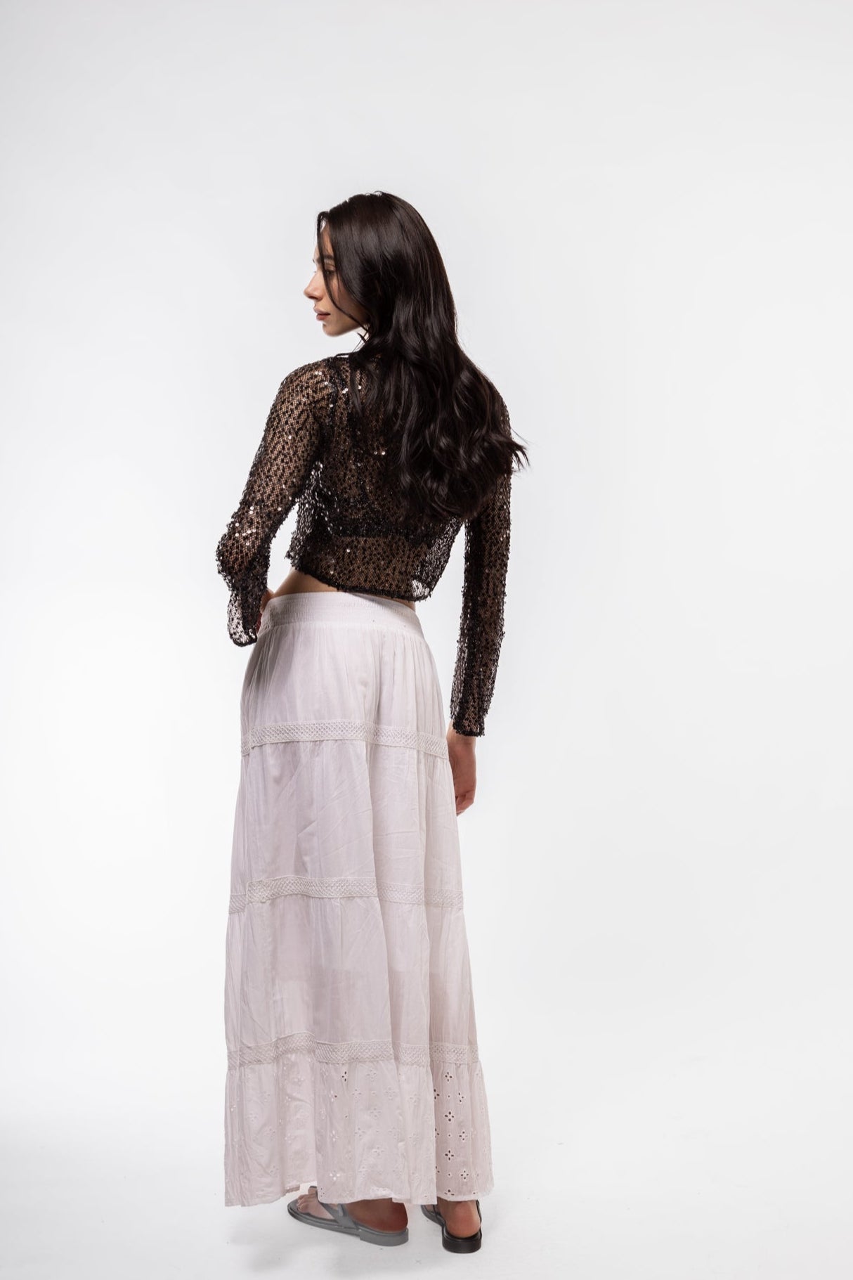 Back view of sequin crochet knit top – shimmering and breathable

