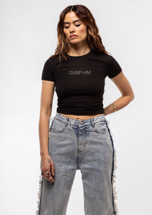 Model wearing a black t-shirt with 'Dump Him' text on a plain background