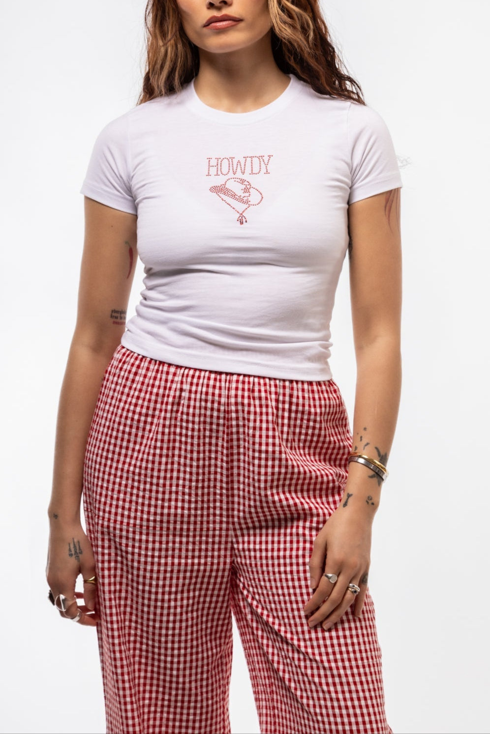 Close-up front image of HOWDY tee highlighting glittery cowboy-inspired text and soft cotton fabric

