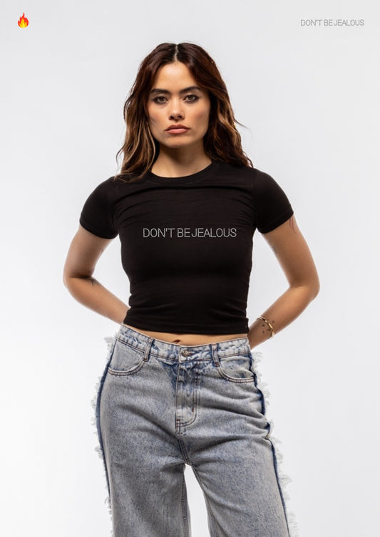 Person wearing a black t-shirt with 'DON'T BE JEALOUS' text on a white background