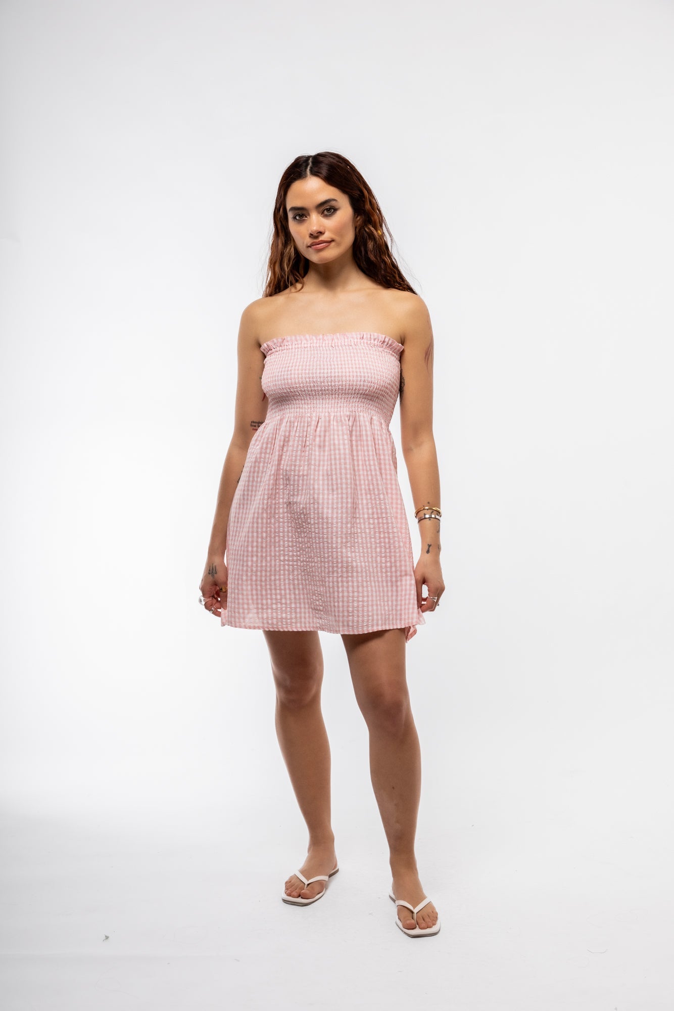 Feminine pastel pink strapless gingham mini dress – front view

