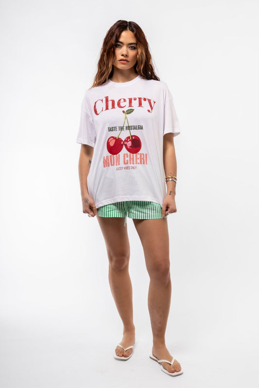 Front view of Cherry oversized tee featuring bold red cherry graphic, “Mon Cheri” slogan, and relaxed drop-shoulder fit

