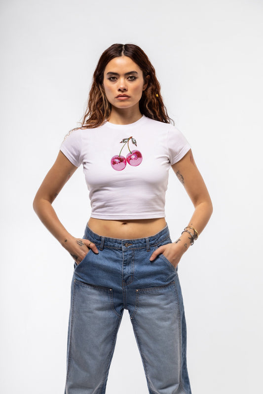 Front view of Disco Cherries baby tee featuring sparkling cherry disco ball graphic and fitted cropped silhouette

