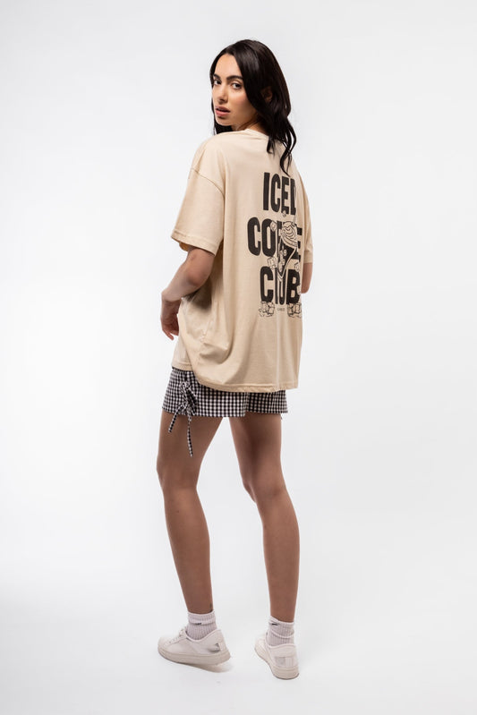 Front view of Iced Coffee Club oversized tee featuring bold slogan and relaxed, drop-shoulder fit

